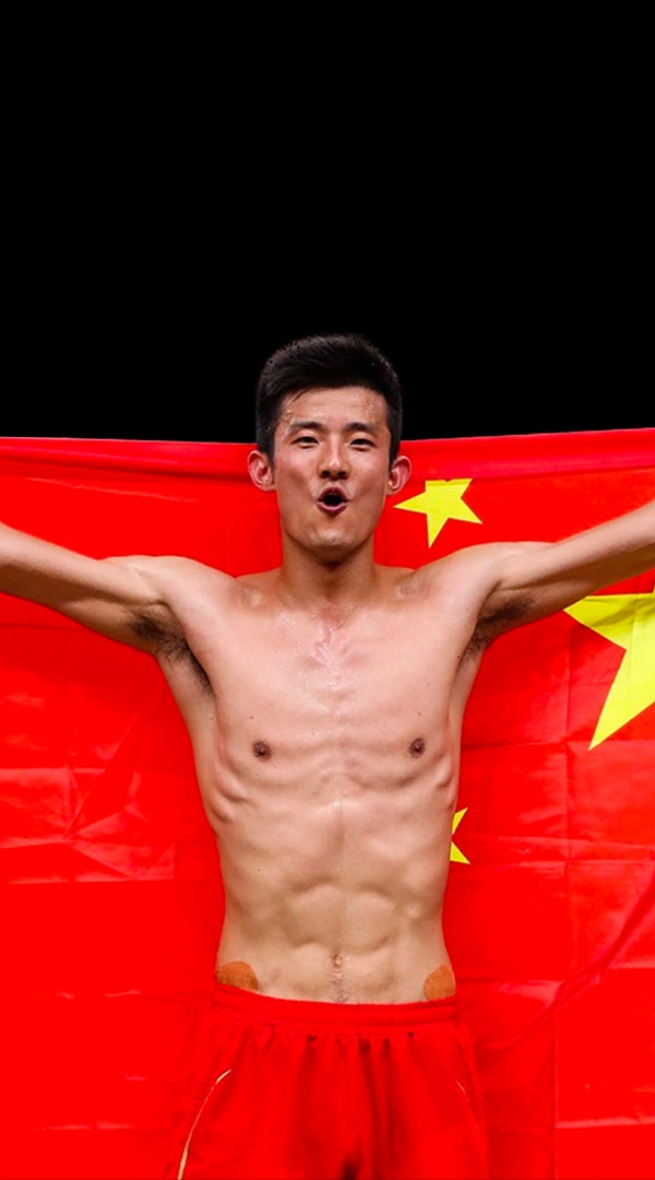 Olympics champion Chen Long holding a Chinese flag