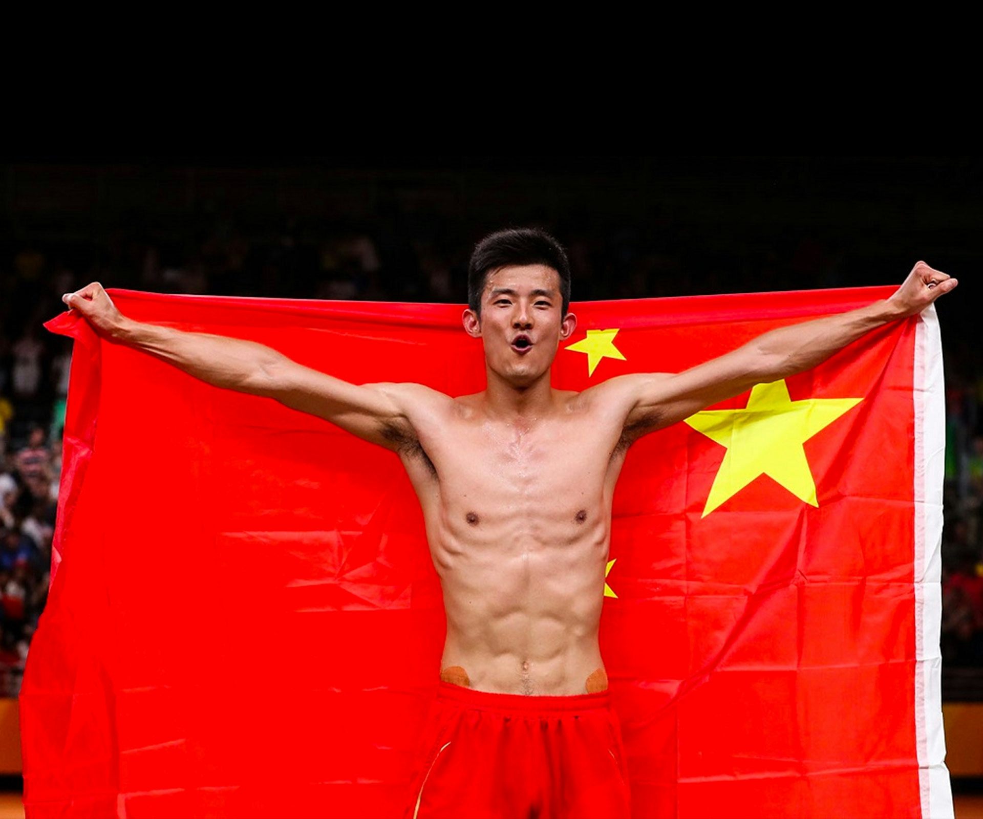 Olympics champion Chen Long holding a Chinese flag